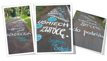 Konkursowe hasła ekologiczne wypisane na ścieżce pieszo-rowerowej